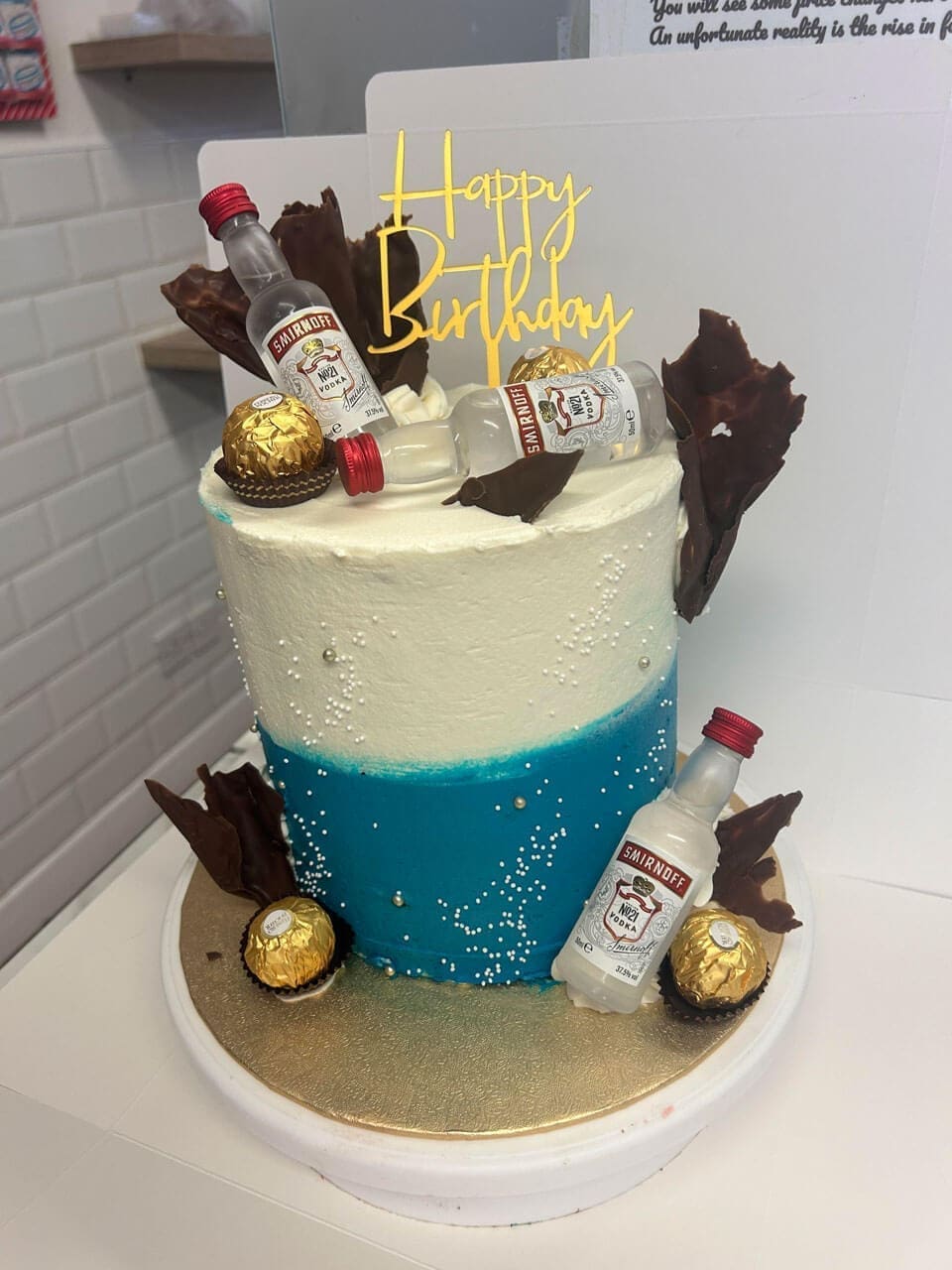 Happy birthday cake with Smirnoff Vodka decorations and Ferrero Rochers Doreens Bakery Athboy