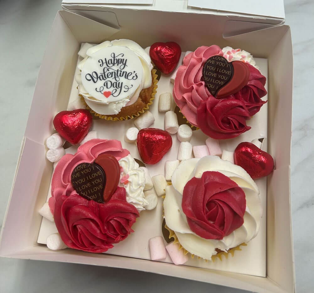 Valentines Day Gift Box with Cupcakes Pink buttercream icing and chocolate decorations Doreens Bakery